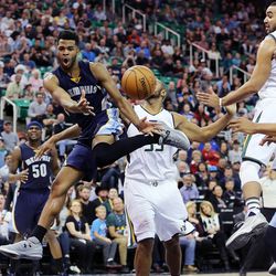 Memphis Grizzlies guard Andrew Harrison (5) passes the ball with Utah Jazz center Boris Diaw (33) defending at back during NBA basketball in Salt Lake City on Monday, Nov. 14, 2016.