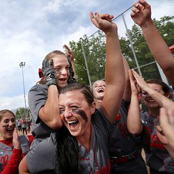 Bear River's Lynsey Valverde gets hoisted onto the back of her teammate, Oakli Rhodes, as the team celebrates its 3A softball championship win against Juab in Spanish Fork on Saturday, May 21, 2016. Valverde scored the game-winning run.