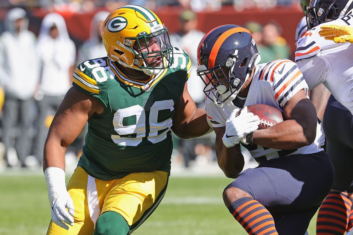 Packers defensive lineman Kingsley Keke tackling Bears running back Khalil Herbert