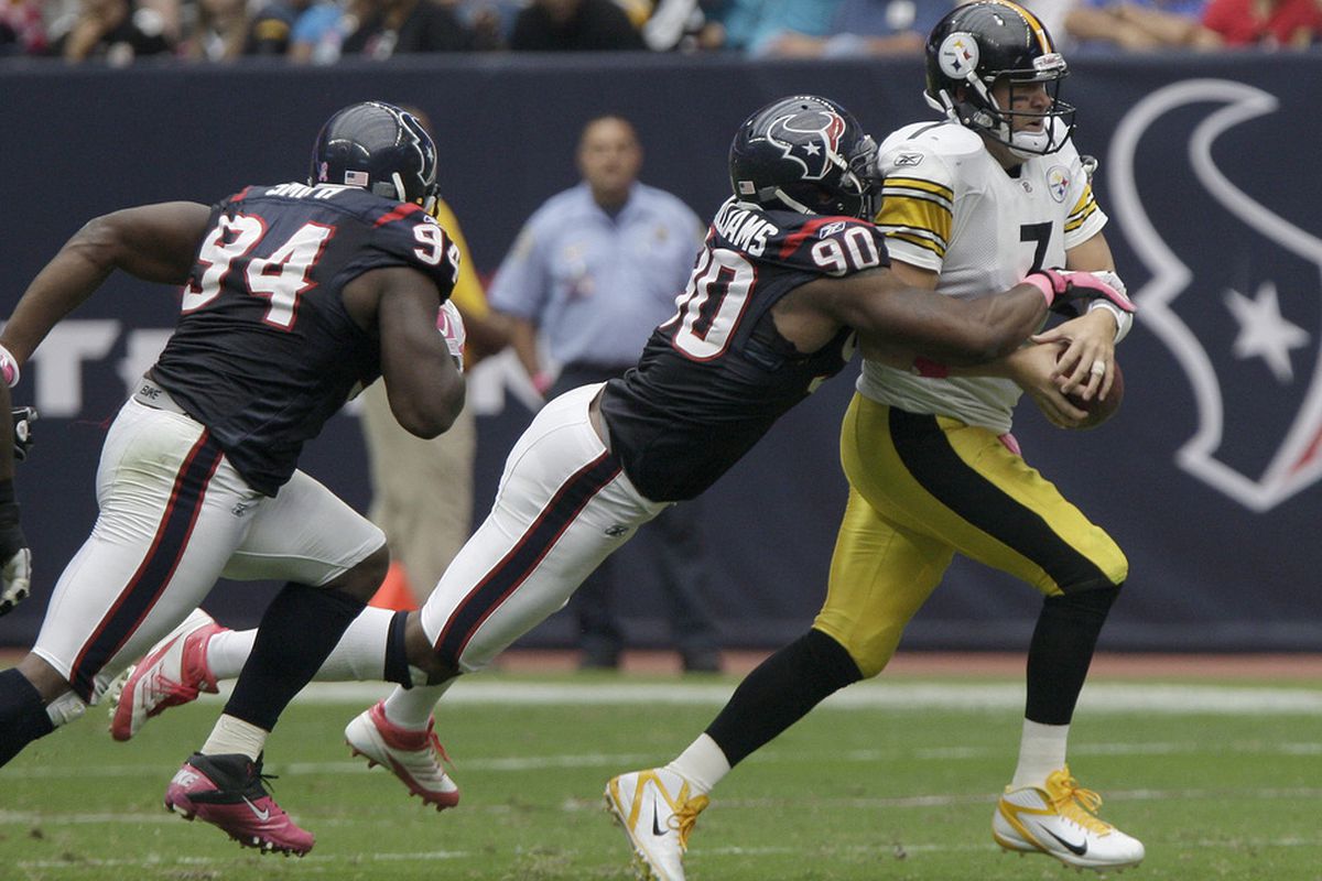 Quarterback Ben Roethlisberger #7 of the Pittsburgh Steelers is sacked by linebacker Mario Williams #90 of the Houston Texans. (Photo by Thomas B. Shea/Getty Images)