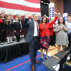 GOP presidential candidate and Texas Sen. Ted Cruz, with his wife Sharon, wave to the crowd at a rally in Draper at the American Preparatory Academy Saturday, March 19, 2016.
