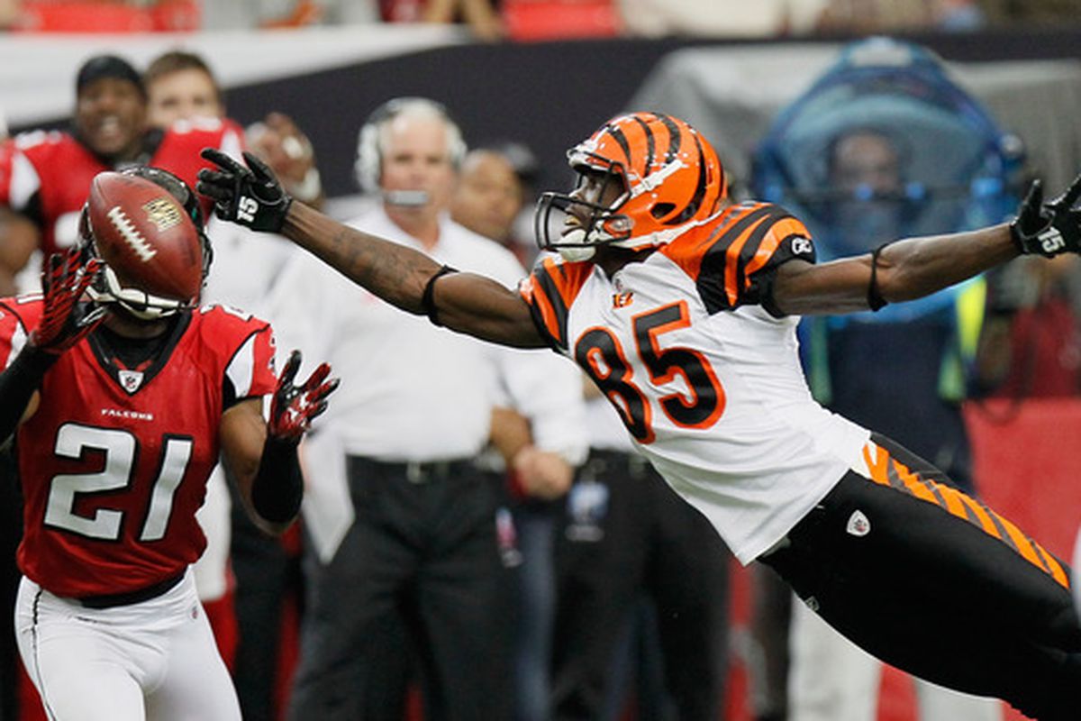 ATLANTA - OCTOBER 24:  Chirstopher Owens #21 of the Atlanta Falcons nearly picks off this pass intended for Chad Ochocinco #85 of the Cincinnati Bengals at Georgia Dome on October 24 2010 in Atlanta Georgia.  (Photo by Kevin C. Cox/Getty Images)