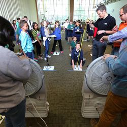 University of Utah engineering students measure the height and strength of straw towers as elementary school students participate Monday, March 23, 2015, in an engineering program at the University of Utah in Salt Lake City.
