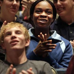 Rosine T. Camah, an East High School student at center of photo, reacts during a music video performance as the Mormon Tabernacle Choir announces the launch of its new YouTube channel in Salt Lake City, Tuesday, Oct. 30, 2012. 