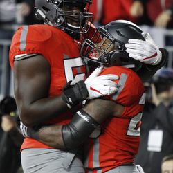 Ohio State running back Mike Weber, right, celebrates his touchdown against Nebraska with teammate Isaiah Prince during the first half of an NCAA college football game Saturday, Nov. 5, 2016, in Columbus, Ohio. 