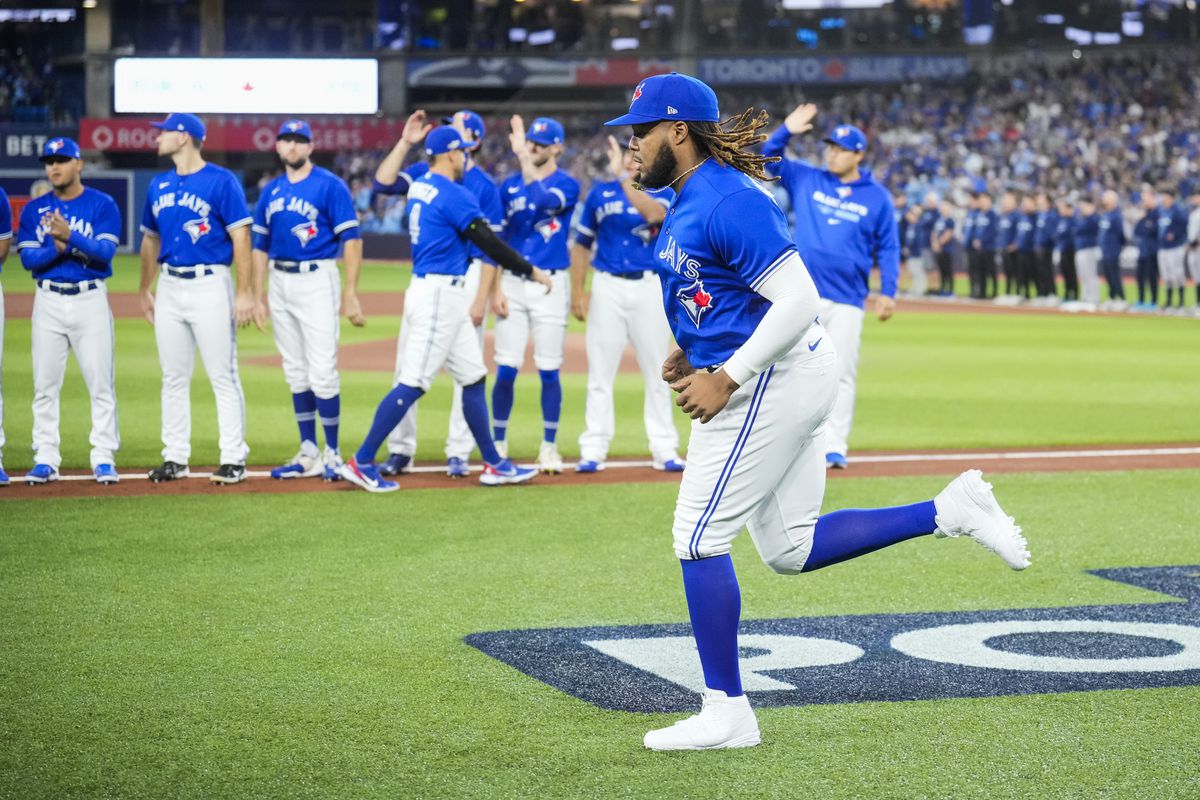 Vladimir Guerrero Jr. of the Toronto Blue Jays takes the field for introductions before playing the Seattle Mariners in Game One of their AL Wild Card series at Rogers Centre on October 7, 2022 in Toronto, Ontario, Canada.