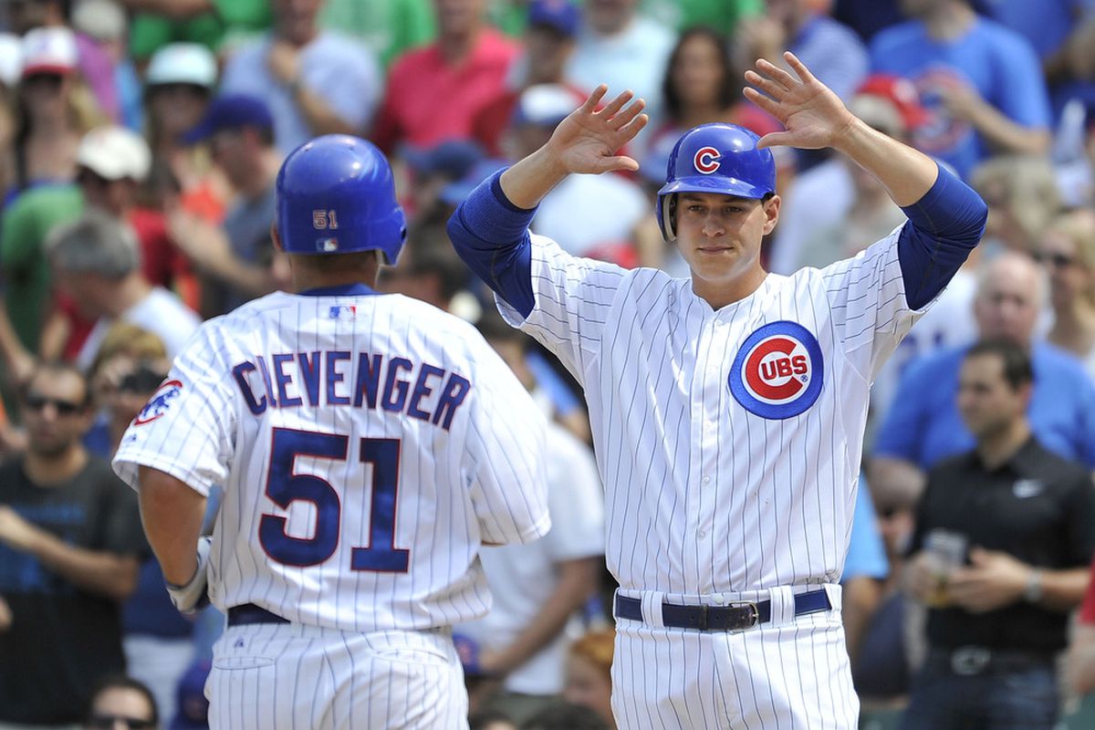 Bryan LaHair of the Chicago Cubs congratulates teammate Steve Clevenger at home plate after Clevenger hit a two-run home run, scoring LaHair against the Houston Astros at Wrigley Field in Chicago, Illinois.  (Photo by Brian Kersey/Getty Images)