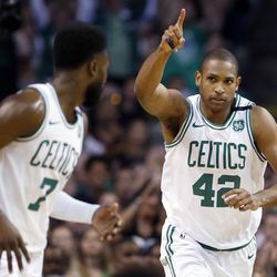 Boston Celtics forward Al Horford (42) celebrates a made basket with guard Jaylen Brown (7) during the first quarter of Game 1 of the NBA basketball Eastern Conference Finals against the Cleveland Cavaliers, Sunday, May 13, 2018, in Boston. (AP Photo/Michael Dwyer)