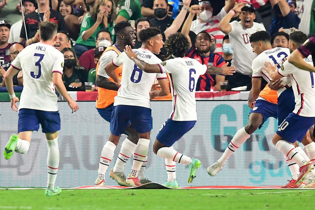 USA team celebrates after USA’s defender Miles Robinson scored during the Concacaf Gold Cup football match final between Mexico and USA at the Allegiant stadium in Las Vegas, Nevada on August 1, 2021.
