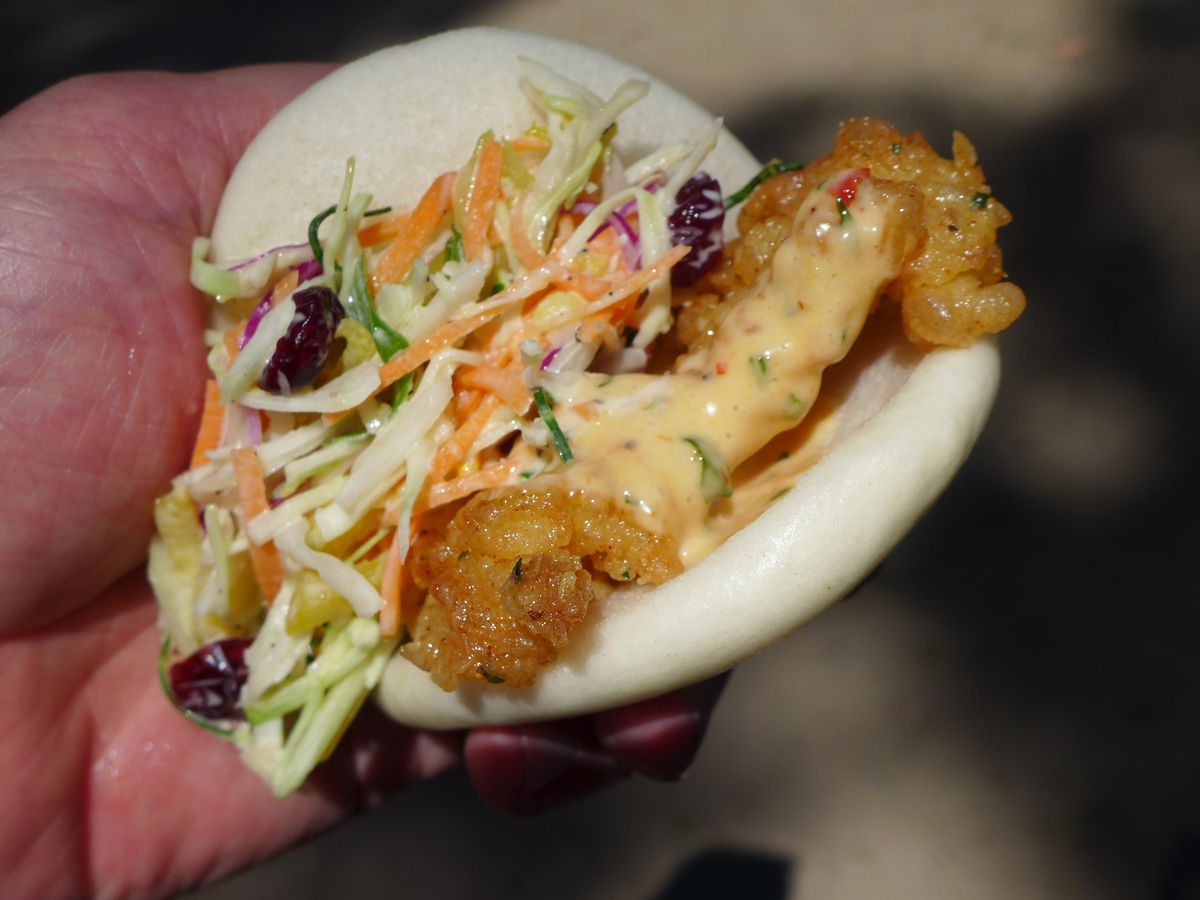 Fried conch and slaw in a folded steamed bao.