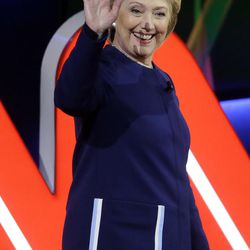 Democratic presidential candidate, Hillary Clinton walks on stage before a Democratic presidential primary debate at the University of Michigan-Flint, Sunday, March 6, 2016, in Flint, Mich. 