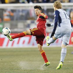 Real's Sabastian Velasquez tries to knock down the ball by Kansas City's Seth Sinovic as Real Salt Lake and Sporting KC play Saturday, Dec. 7, 2013 in MLS Cup action. Sporting KC won in a shootout.