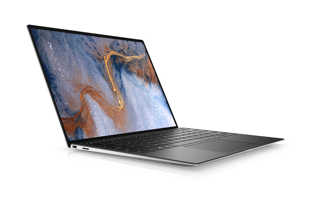 The Dell XPS 13 seen from the left side on a white background. The screen displays a blue, white, and orange marbled pattern.