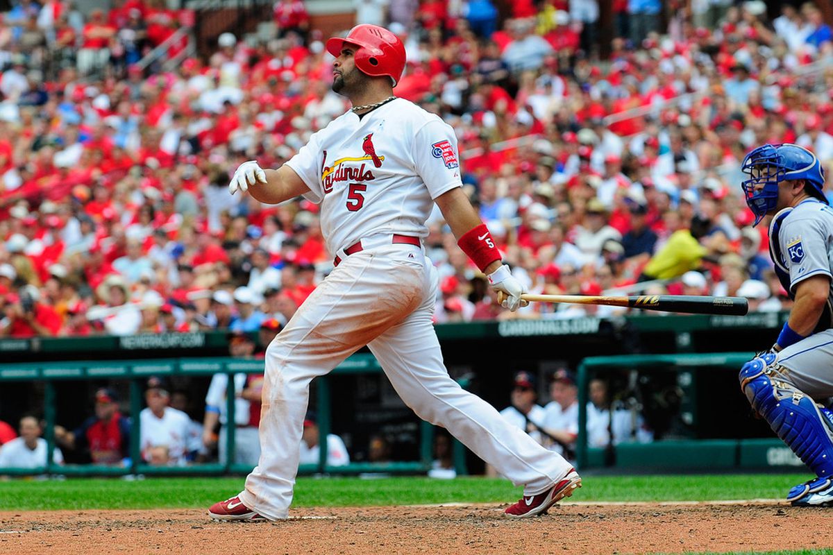 ST. LOUIS, MO - JUNE 19: Albert Pujols #5 of the St. Louis Cardinals follows through on a solo home run against the Kansas City Royals at Busch Stadium on June 19, 2011 in St. Louis, Missouri.  (Photo by Jeff Curry/Getty Images)