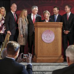 Karen Huntsman, center, is surrounded by family members during a press conference at the University of Utah’s Park Building in Salt Lake City on Monday, Nov. 4, 2019, where the Huntsman family announced a $150 million commitment to establish the Huntsman Mental Health Institute at the U. The funding, pledged over 15 years, will be used to support research, expand access to patient care and build awareness about mental health.