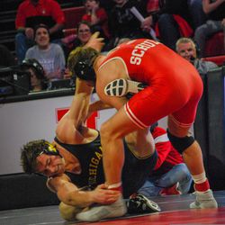 Nebraska’s Eric Schultz drags Michigan’s Jackson Striggow back in bounds during their 197-pound match Friday at the Devaney Sports Center.