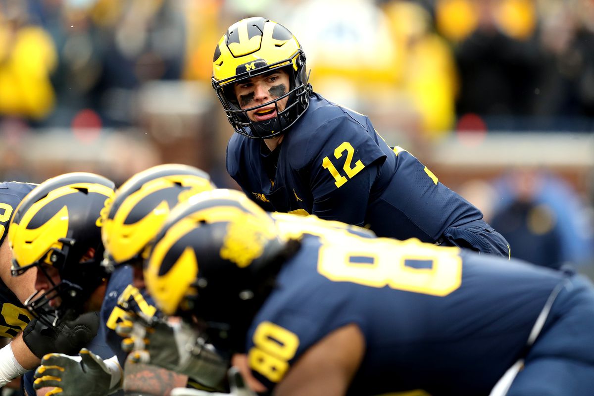 Cade McNamara of the Michigan Wolverines looks up before the snap in the third quarter against the Ohio State Buckeyes at Michigan Stadium on November 27, 2021 in Ann Arbor, Michigan.