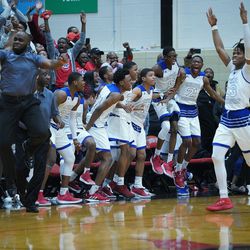 Curie celebrates after Damari Nixon (2) hits a three pointer to put them in the lead over Young, Friday 03-08-19. Worsom Robinson/For the Sun-Times.