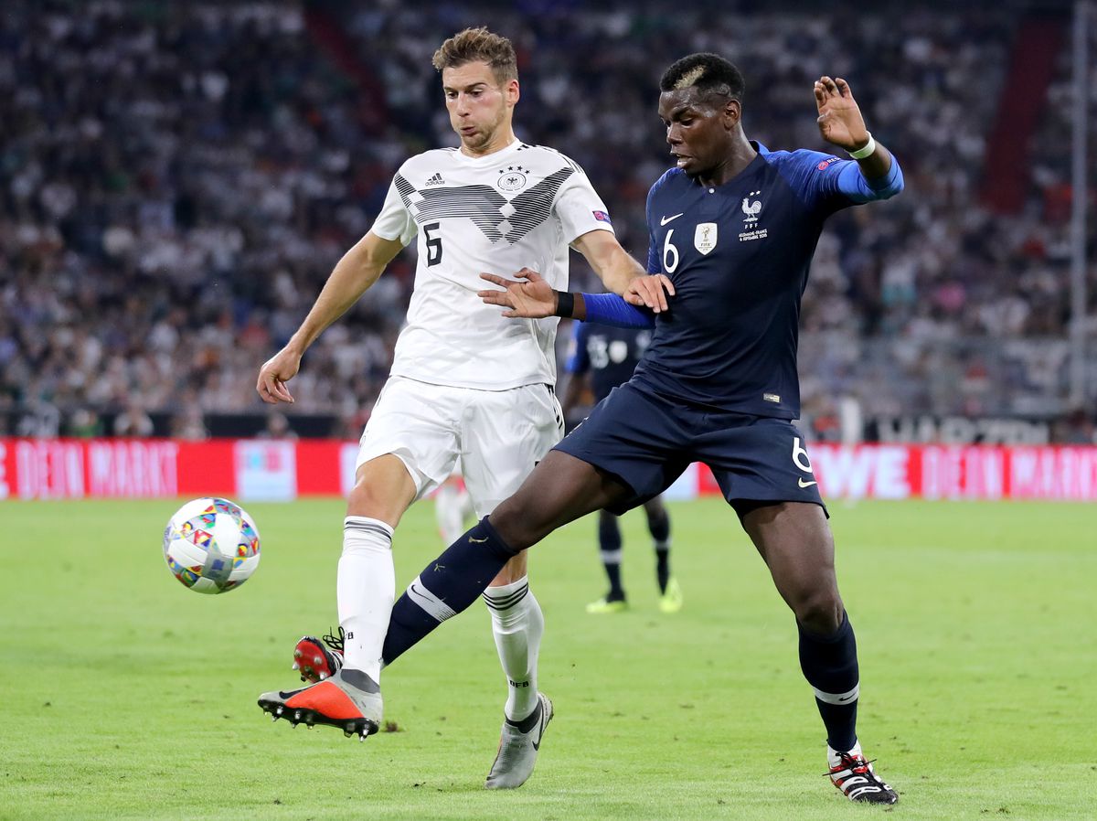 MUNICH, GERMANY - SEPTEMBER 06: Leon Goretzka of Germany is challenged by Paul Pogba of France during the UEFA Nations League Group A match between Germany and France at Allianz Arena on September 6, 2018 in Munich, Germany.
