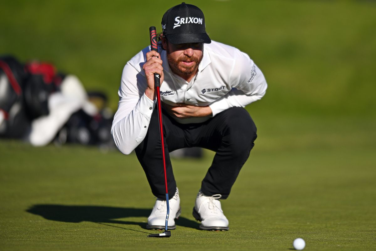 Sam Ryder of the United States lines up a putt on the 18th green of the South Course during the second round of the Farmers Insurance Open at Torrey Pines Golf Course on January 26, 2023 in La Jolla, California.