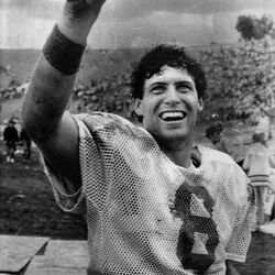 BYU quarter back Steve Young responds to BYU fans as he departs the field after leading his team to a 37-35 victory over UCLA at the Pasadena Rose Bowl. (1983)