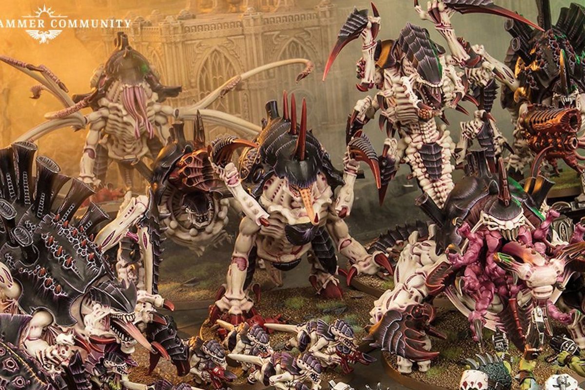 Warhammer 40K - a vast array of Tyranid models arranged on the tabletop, ready for a battle through the destroyed ruins of a city.