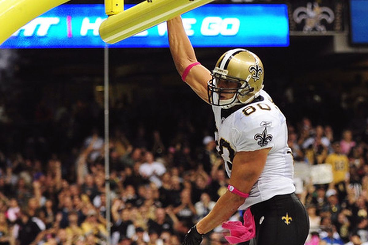 New Orleans Saints tight end Jimmy Graham dunks the ball over the goalpost after a touchdown against the Seattle Seahawks