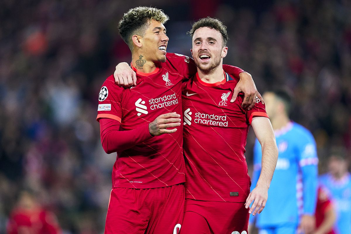 Jota and Roberto Firmino of Liverpool FC celebrate a goal after disallowed by VAR during the UEFA Champions League group B match between Liverpool FC and Atletico Madrid at Anfield on November 03, 2021 in Liverpool, England.