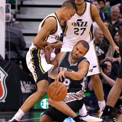 San Antonio Spurs guard Tony Parker (9) runs into Utah Jazz guard Dante Exum (11) as the Utah Jazz defeat the San Antonio Spurs 90-81 in NBA basketball Monday, Feb. 23, 2015, in Salt Lake City.  
