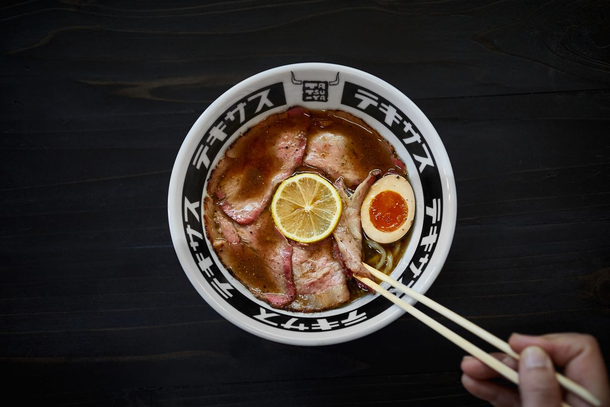 A bowl of ramen with meats.