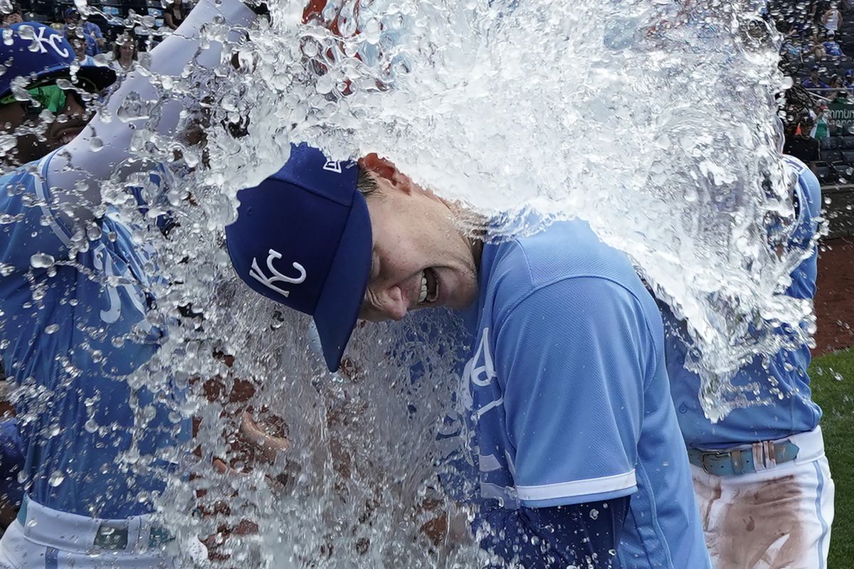 Brady Singer #51 of the Kansas City Royals is doused with water by MJ Melendez #1 and Bobby Witt Jr. #7 as they celebrate a 9-2 win over the New York Mets at Kauffman Stadium on August 03, 2023 in Kansas City, Missouri.
