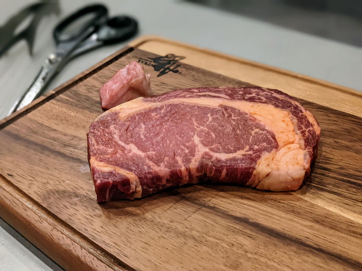 Cured, dry-aged Korean steak on a cutting board.