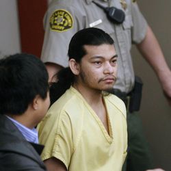 Esar Met, accused of killing 7-year-old Hser Ner Moo in 2008, enters Judge William Barrett's courtroom in Salt Lake City Tuesday Nov. 13, 2012,  for his preliminary hearing. 