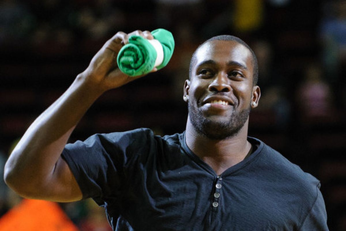 The Seattle Storm fanbase is welcome to everyone, Storm season ticket holder Patrick Sheehy says.  Here, Seattle Seahawks safety Kam Chancellor enjoys his time at a game and takes part in throwing giveaways to fans.