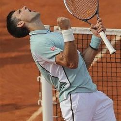 Serbia's Novak Djokovic celebrates defeating Germany's Tommy Haas in three sets 6-3, 7-6, 7-5, in their quarterfinal match at the French Open tennis tournament, at Roland Garros stadium in Paris, Wednesday June 5, 2013. (AP Photo/Michel Euler)