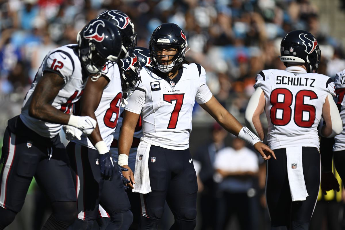 CHARLOTTE, NORTH CAROLINA - OCTOBER 29: C.J. Stroud #7 of the Houston Texans talks with his team against the Carolina Panthers in the third quarter at Bank of America Stadium on October 29, 2023 in Charlotte, North Carolina.