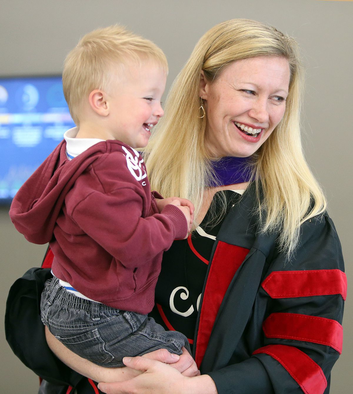 Kim Reeves holds son Gunnar at a commencement reception at the University of Utah's S.J. Quinney College of Law in Salt Lake City on Friday, May 11, 2018.
