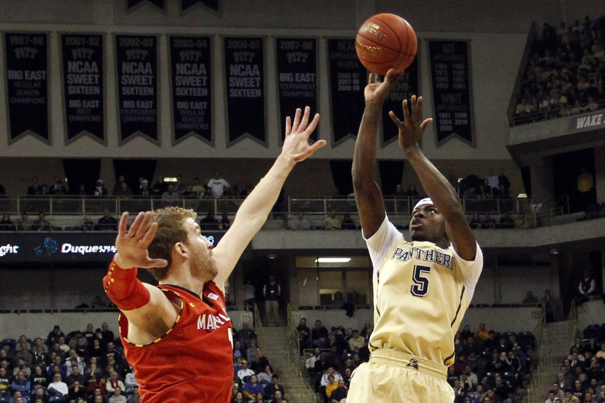 Pitt's Durand Johnson shoots over Evan Smotrycz earlier this month. Johnson will miss the remainder of the season with a torn ACL.