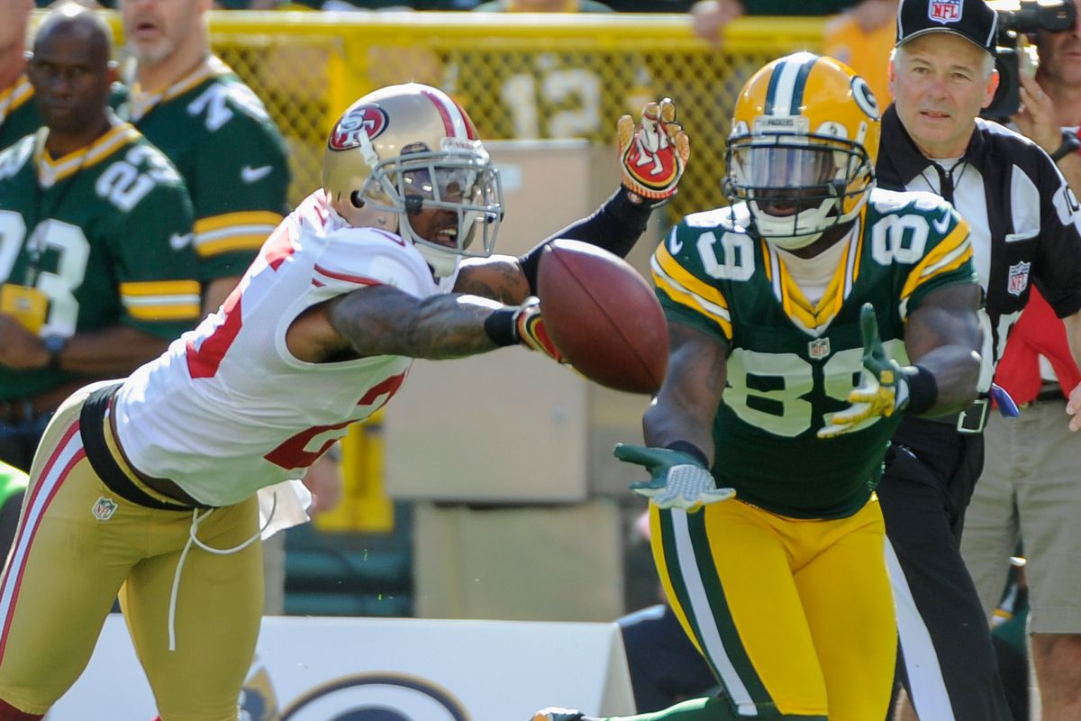 Sept 9, 2012; Green Bay, WI, USA;   Green Bay Packers wide receiver James Jones (89) can't catch a pass while being defended by San Francisco 49ers cornerback Tarell Brown (25) at Lambeau Field.  Mandatory Credit: Benny Sieu-US PRESSWIRE