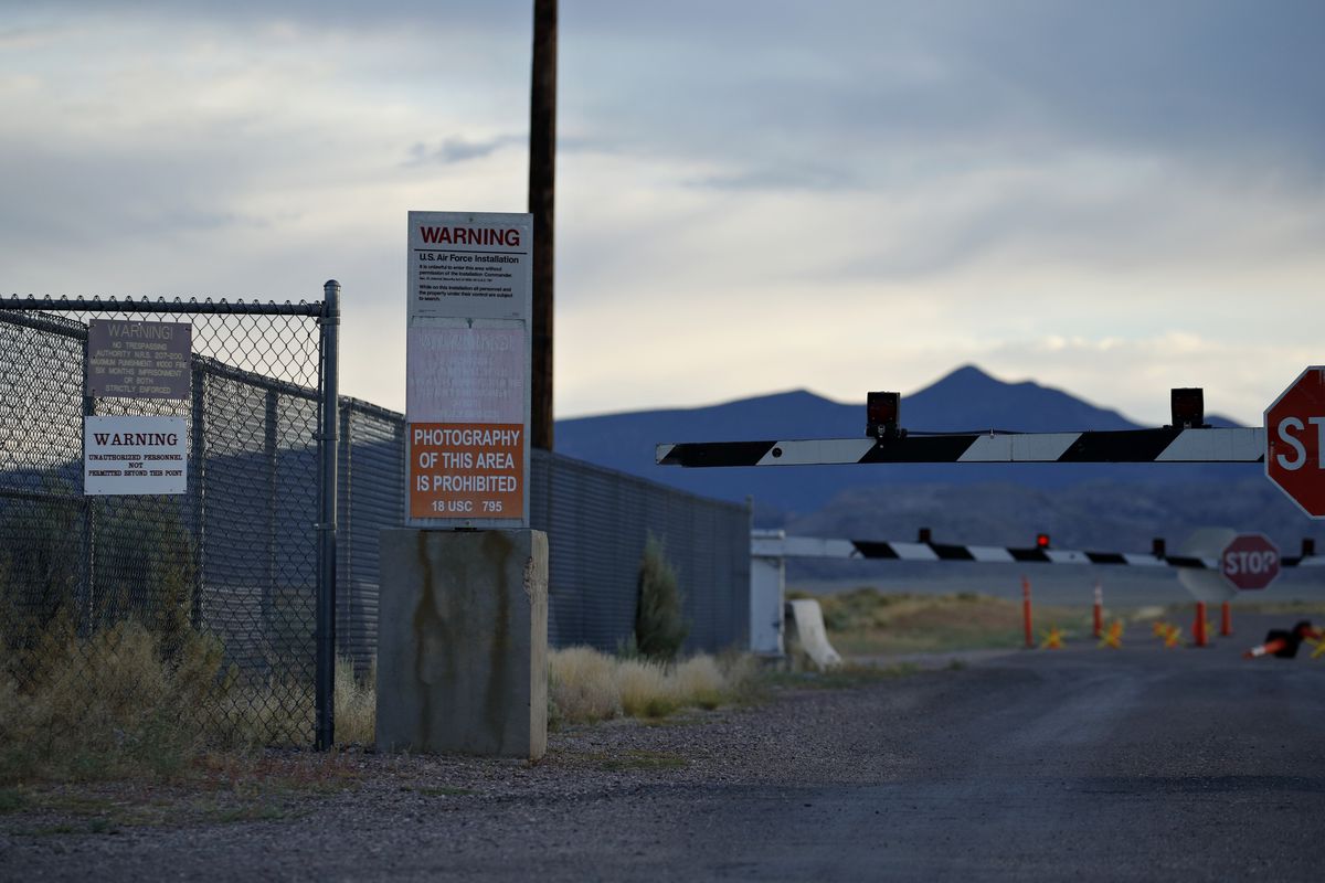 In this July 22, 2019 photo, signs warn about trespassing at an entrance to the Nevada Test and Training Range near Area 51 outside of Rachel, Nev. The U.S. Air Force has warned people against participating in an internet joke suggesting a large crowd of 