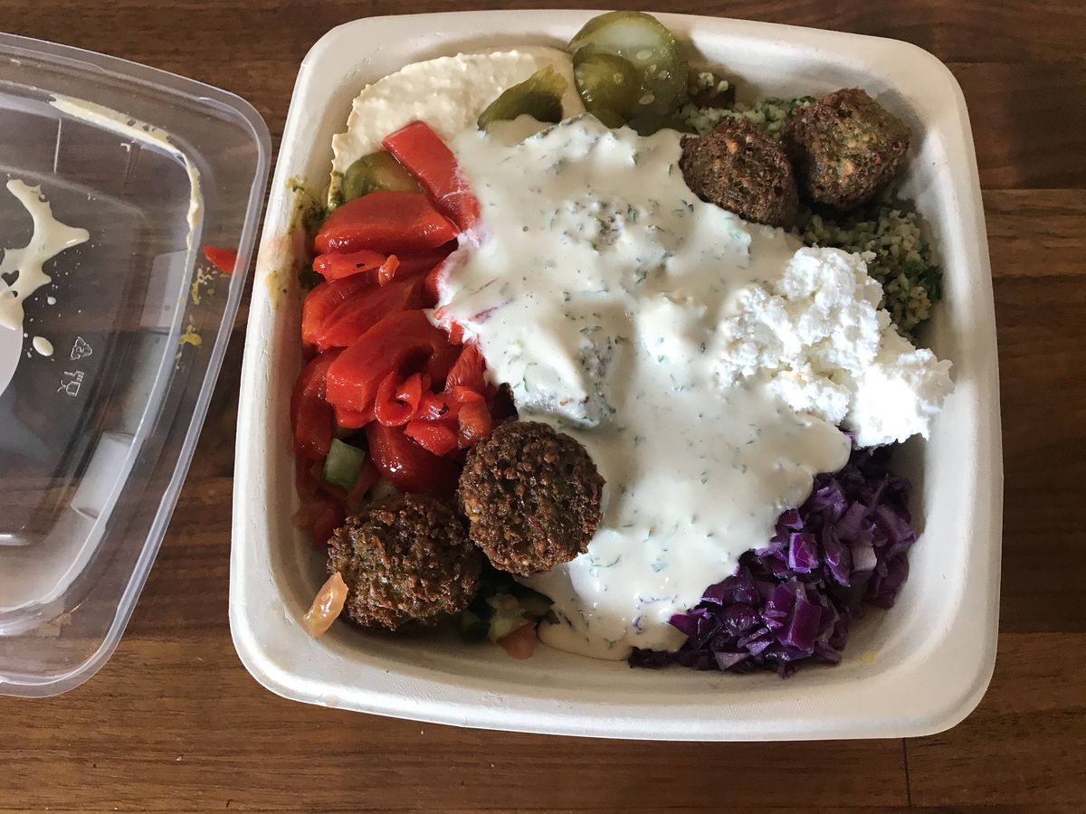 Falafel plate drizzled with tahini dressing