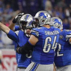 Detroit Lions kicker Matt Prater is congratulated by teammates after kicking a 40-yard game winning field goal during the second half of an NFL football game against the Minnesota Vikings, Thursday, Nov. 24, 2016 in Detroit. 