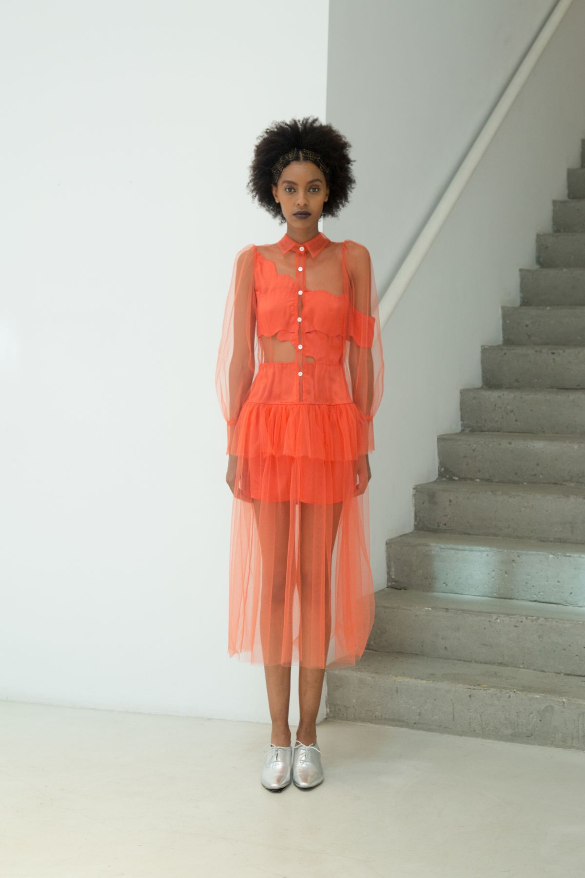 An orange sheer dress