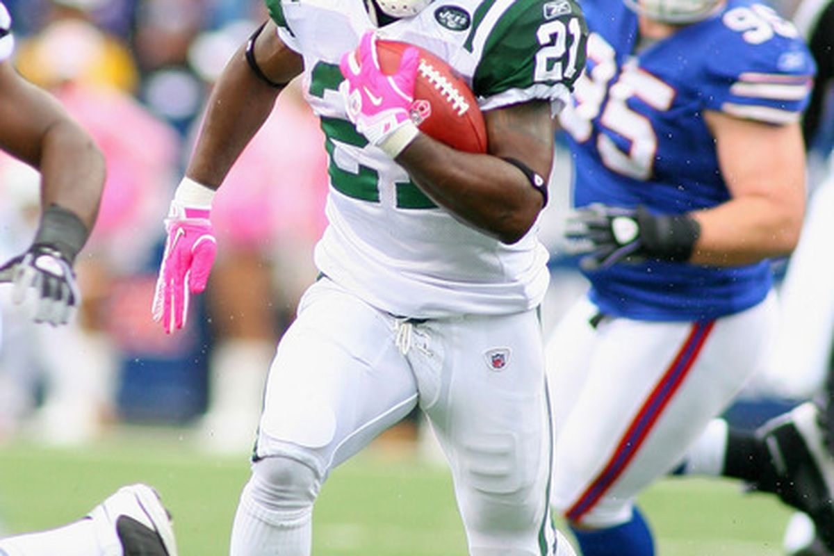 ORCHARD PARK NY - OCTOBER 03: LaDanian Tomlinson #21 of the New York Jets runs against the Buffalo Bills at Ralph Wilson Stadium on October 3 2010 in Orchard Park New York. The Jets won 38-14. (Photo by Rick Stewart/Getty Images)