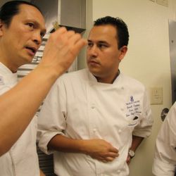 Chef Suser Lee talks plating design with his team.