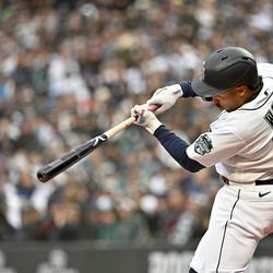 Kolten Wong #16 of the Seattle Mariners bats during the first inning against the Cleveland Guardians at T-Mobile Park on April 01, 2023 in Seattle, Washington.