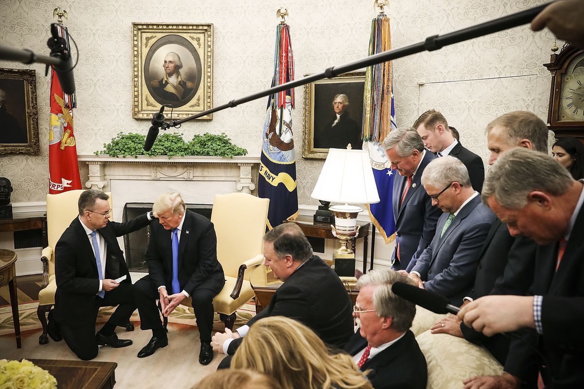 President Trump and American evangelical Christian preacher Andrew Brunson (left) pray together in the Oval Office, a day after Brunson was released from a Turkish jail, on October 13, 2018.