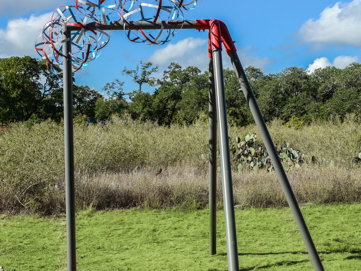 A work of art called Safety First World&nbsp;by Rebekah Rauser. There are multiple poles and an abstract shape emerging.