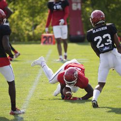 University of Utah running back Zack Moss rolls after a play ends during a drill during football practice in Salt Lake City on Thursday, Aug. 3, 2017.