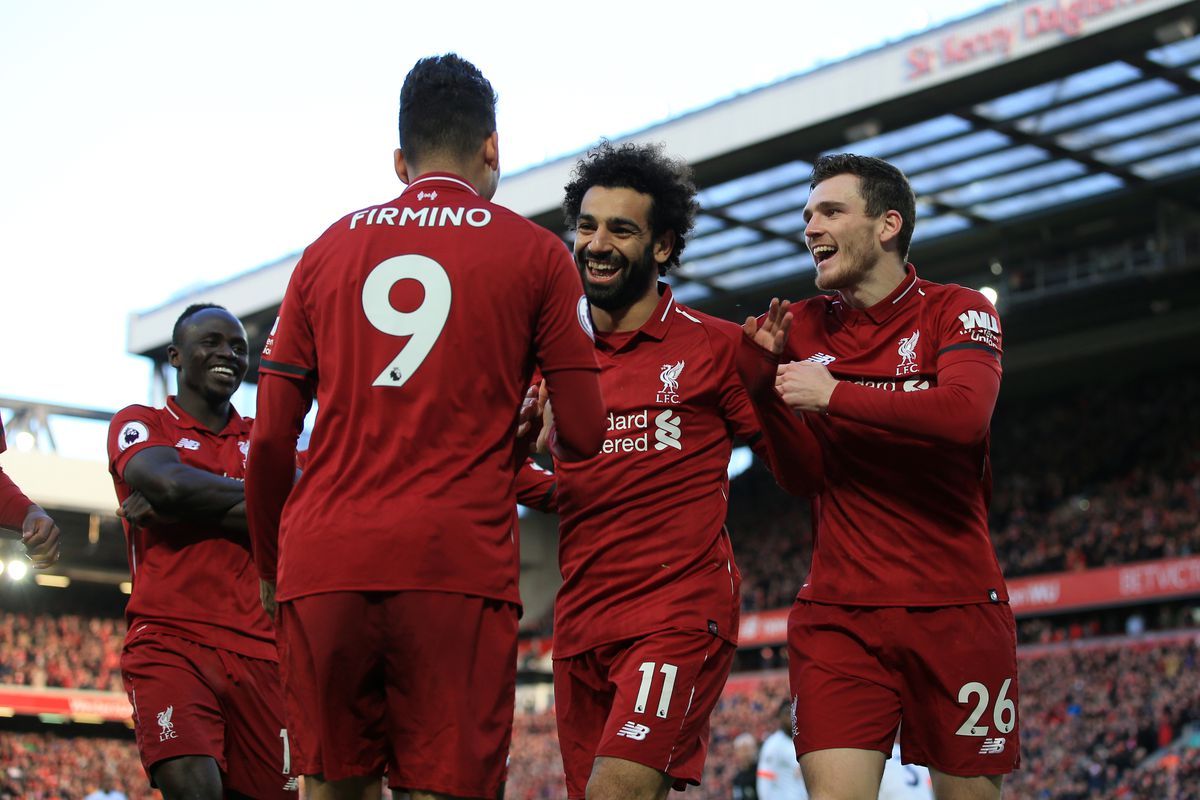 Liverpool v AFC Bournemouth - Premier League
LIVERPOOL, ENGLAND - FEBRUARY 09: Mohamed Salah of Liverpool (2R) celebrates with teammates Andrew Robertson of Liverpool (R), Roberto Firmino of Liverpool (2L) and Sadio Mane of Liverpool (L) after scoring their 3rd goal during the Premier League match between Liverpool and AFC Bournemouth at Anfield on February 9, 2019 in Liverpool, United Kingdom.